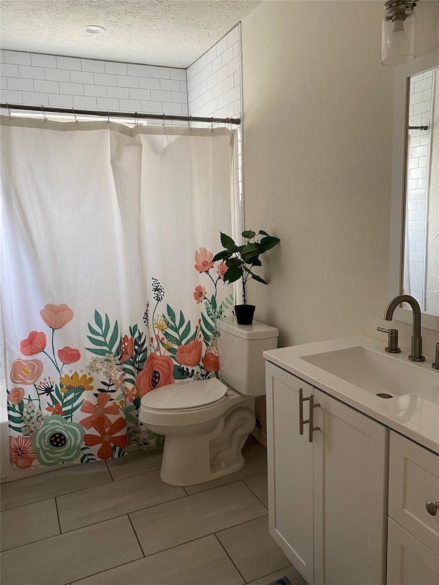 full bathroom featuring toilet, a textured ceiling, shower / bathtub combination with curtain, and vanity