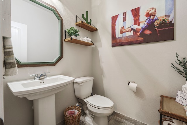 bathroom with toilet and sink