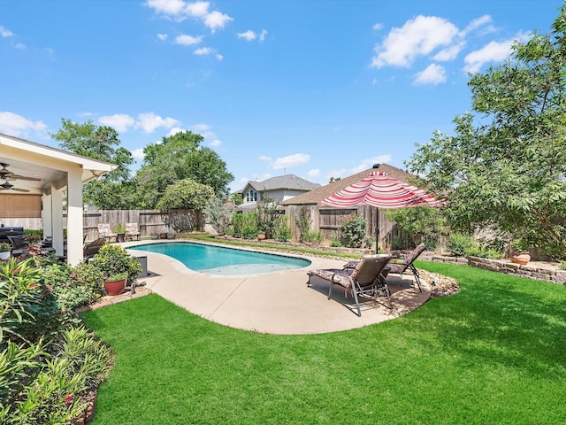 view of pool with a patio area, a yard, and ceiling fan