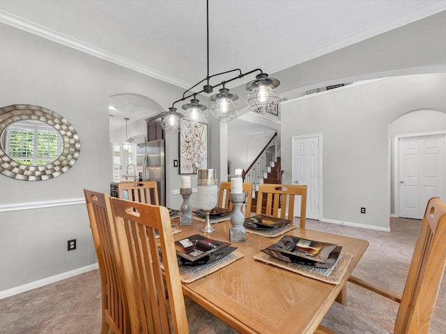 dining area with crown molding