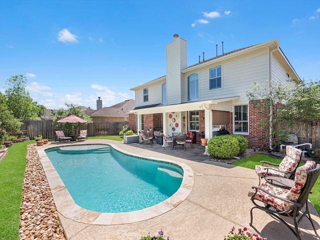 view of swimming pool with a patio