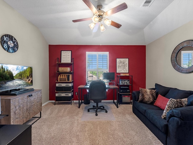 carpeted office featuring vaulted ceiling and ceiling fan