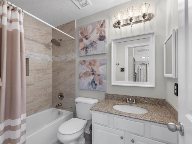 full bathroom featuring toilet, a textured ceiling, shower / tub combo with curtain, and vanity