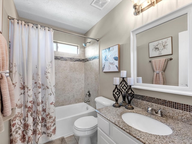 full bathroom with tile patterned flooring, a textured ceiling, toilet, vanity, and shower / bathtub combination with curtain