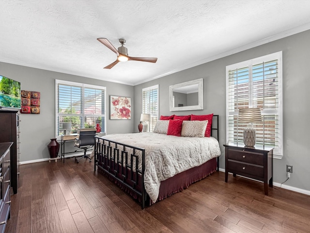 bedroom featuring ceiling fan, ornamental molding, dark hardwood / wood-style flooring, and multiple windows