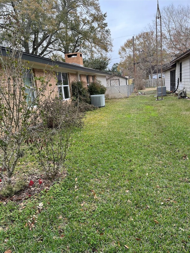 view of yard featuring central AC unit