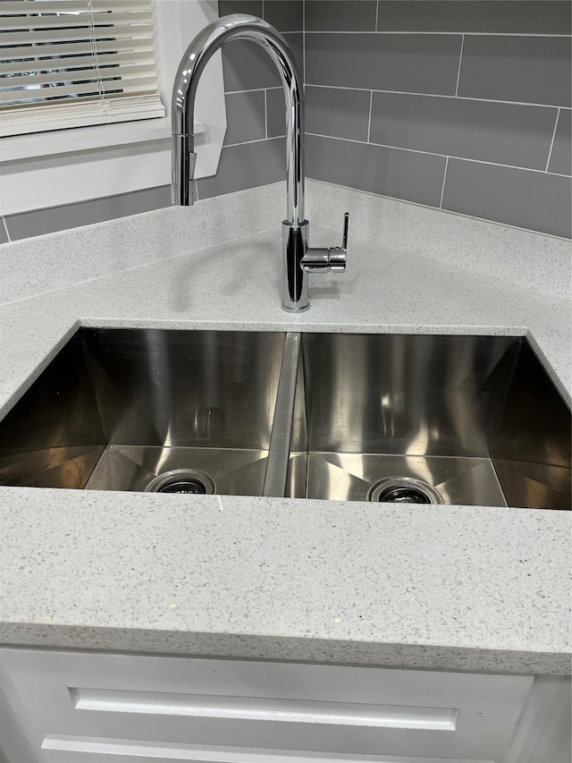 interior details with light stone counters and sink