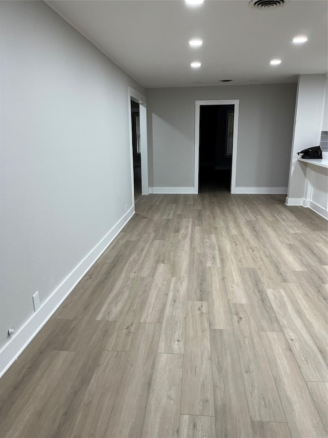 unfurnished living room with light hardwood / wood-style flooring