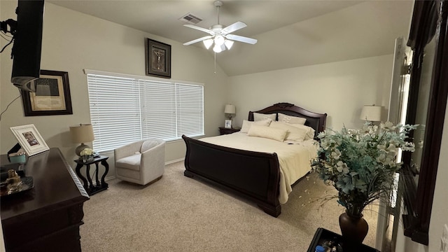 bedroom featuring lofted ceiling, light colored carpet, and ceiling fan