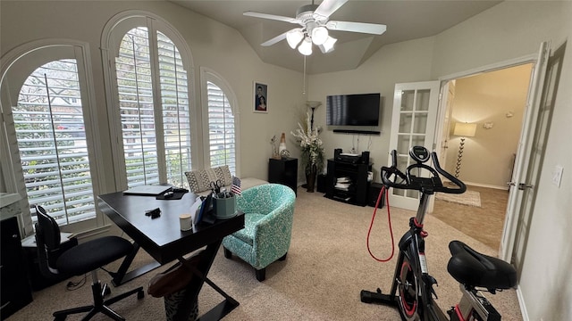 carpeted office with ceiling fan and lofted ceiling