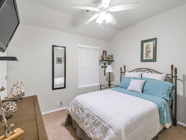 bedroom featuring vaulted ceiling, carpet floors, and ceiling fan