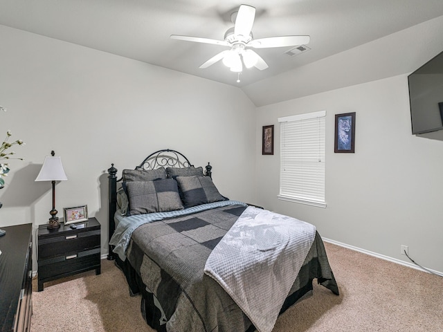 bedroom with ceiling fan, vaulted ceiling, and carpet