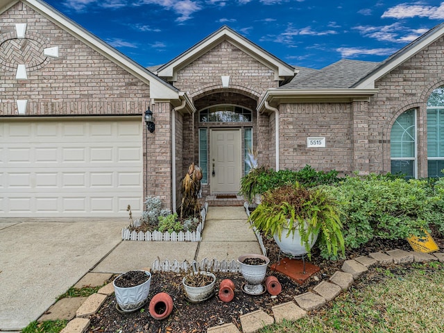 view of exterior entry featuring a garage