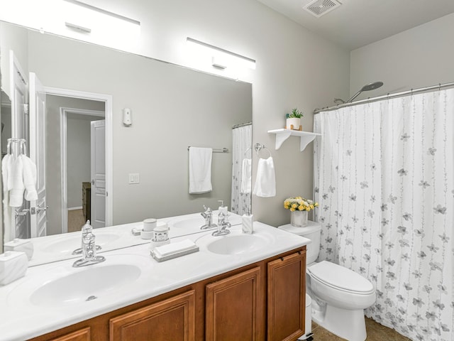 bathroom featuring vanity, a shower with curtain, and toilet