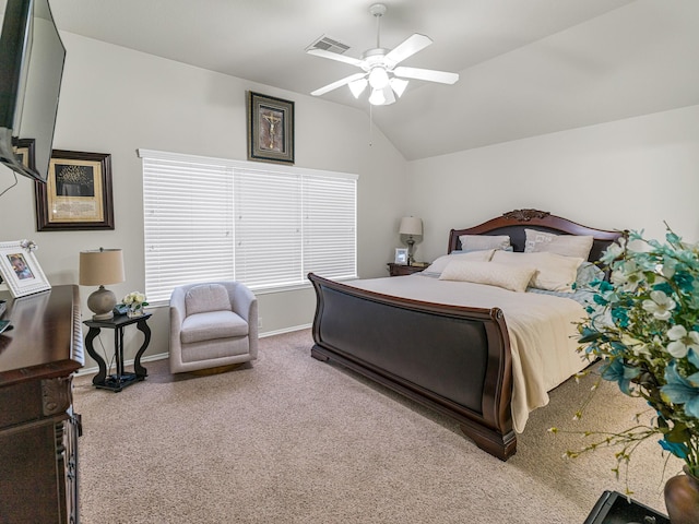 bedroom featuring vaulted ceiling, light colored carpet, and ceiling fan