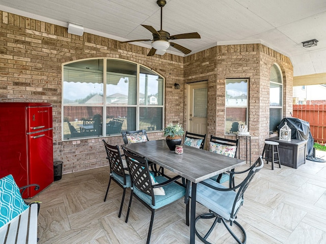 view of patio / terrace featuring a grill and ceiling fan