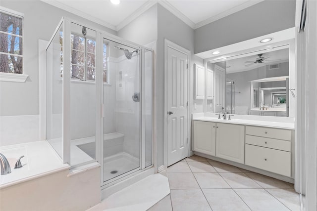 bathroom with crown molding, ceiling fan, vanity, tile patterned floors, and walk in shower