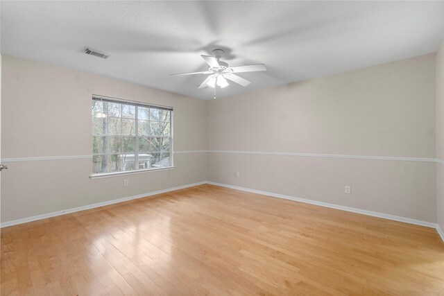 unfurnished room with ceiling fan and light hardwood / wood-style floors