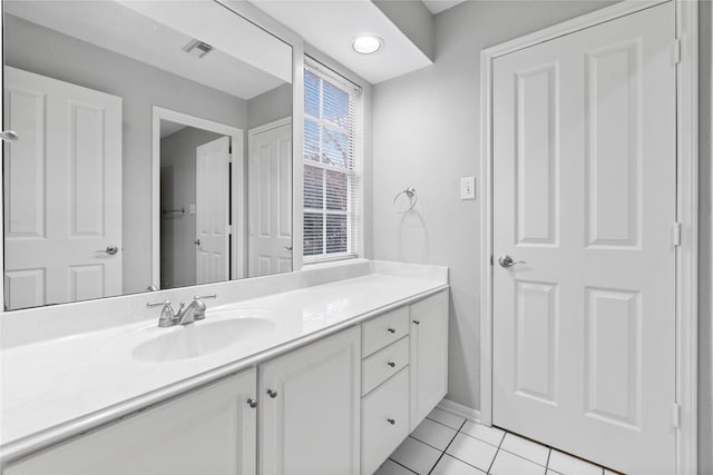 bathroom with vanity and tile patterned flooring