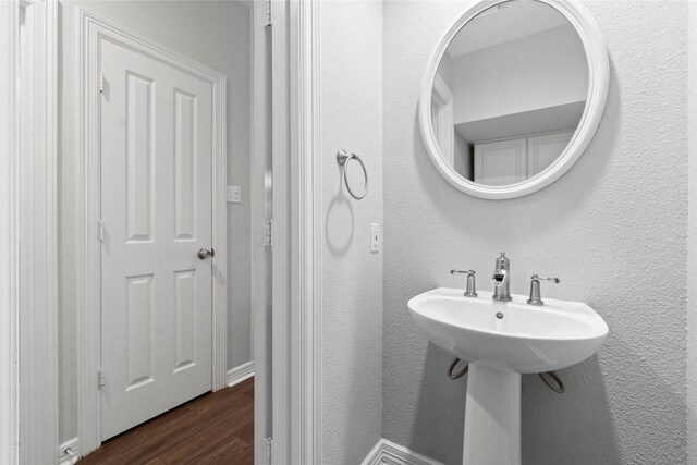 bathroom with sink and hardwood / wood-style floors