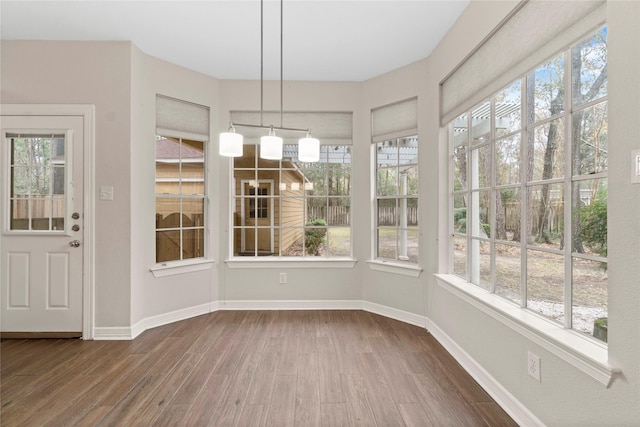 unfurnished sunroom with a wealth of natural light