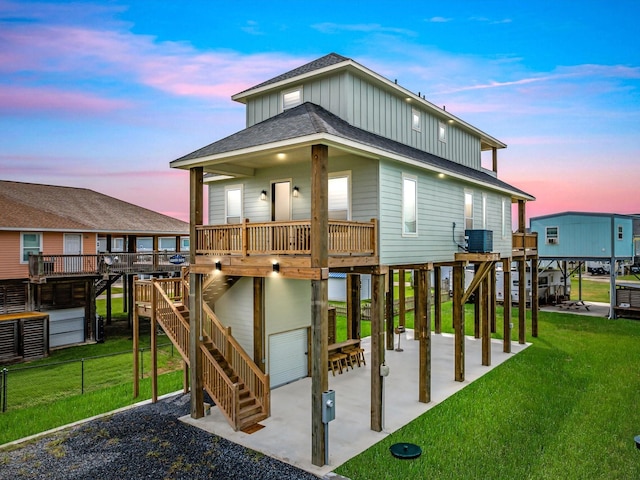 1998 Royalville Ct, Crystal Beach, TX 77650 - playground at dusk with cooling unit, a lawn, and a patio