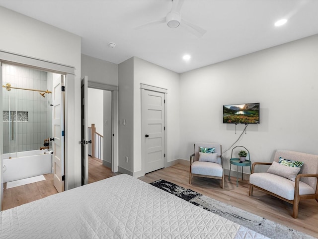 bedroom with ceiling fan and hardwood / wood-style flooring