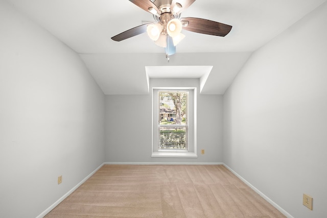 additional living space featuring vaulted ceiling, ceiling fan, and light carpet