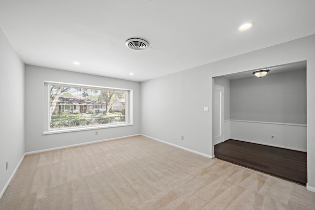 empty room featuring light carpet