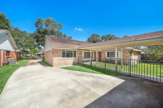 single story home featuring central AC unit and a front lawn