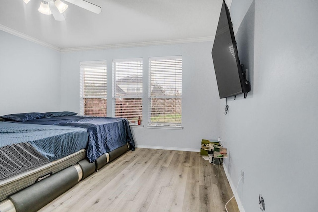 bedroom with crown molding, light wood-type flooring, and ceiling fan