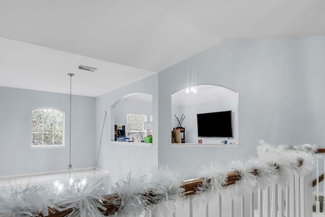 unfurnished living room with lofted ceiling