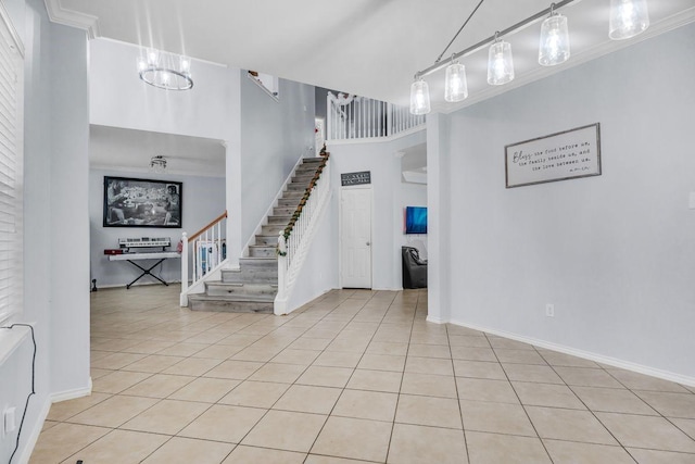 tiled foyer with ornamental molding