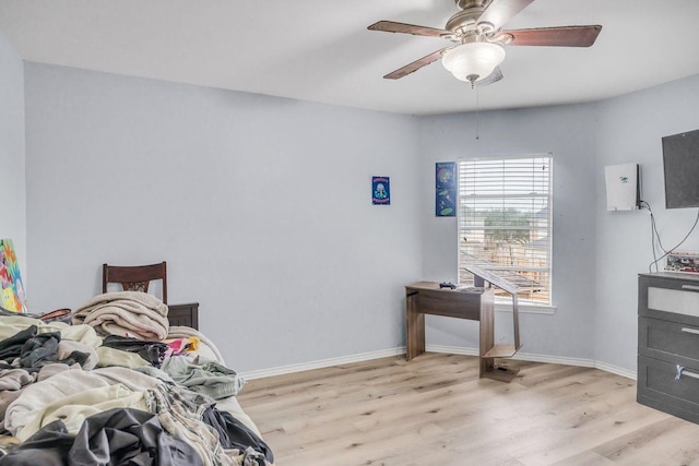 bedroom featuring ceiling fan and light hardwood / wood-style flooring