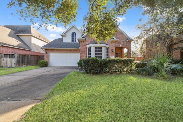 front facade with a garage and a front yard