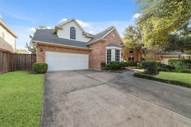 front of property featuring a front yard and a garage