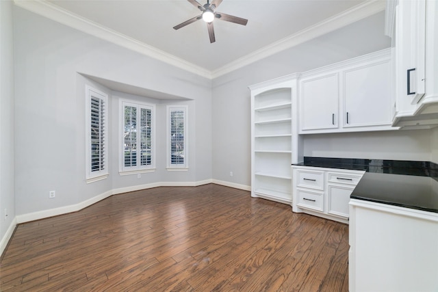 kitchen with ceiling fan, white cabinets, dark hardwood / wood-style floors, and crown molding