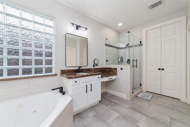 bathroom with separate shower and tub and vanity