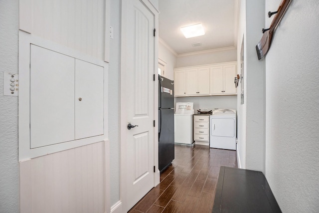 interior space with wood finish floors, a textured wall, washer / dryer, and crown molding