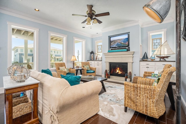 living room featuring ornamental molding and ceiling fan