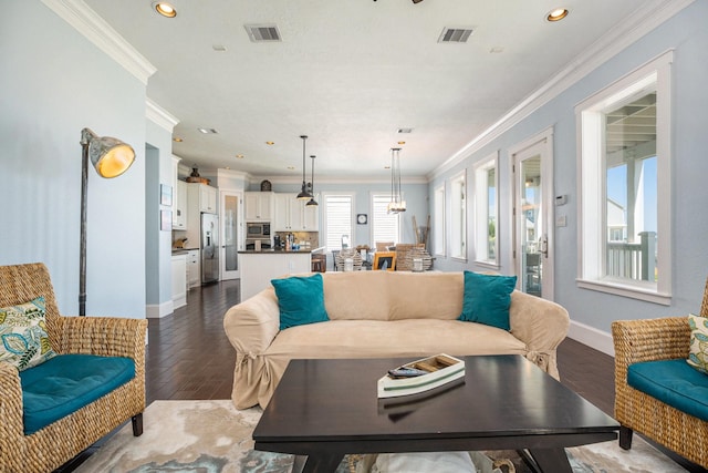 living room featuring baseboards, dark wood-style floors, visible vents, and crown molding