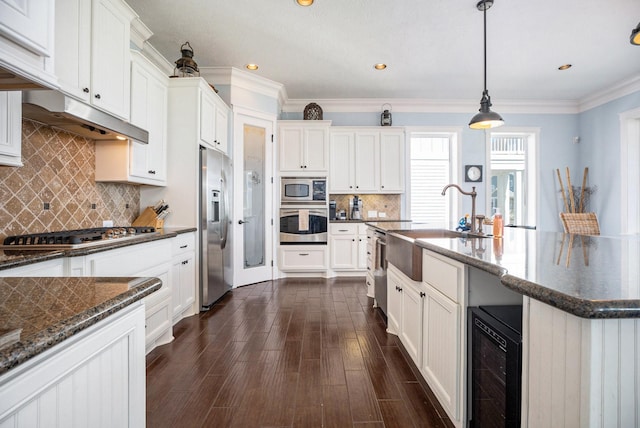 kitchen featuring wine cooler, white cabinetry, decorative light fixtures, appliances with stainless steel finishes, and dark hardwood / wood-style floors