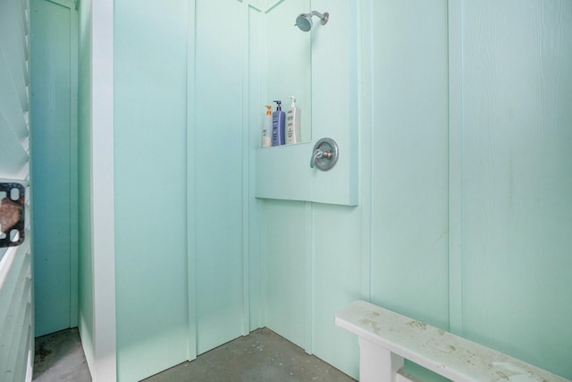 bathroom with unfinished concrete flooring