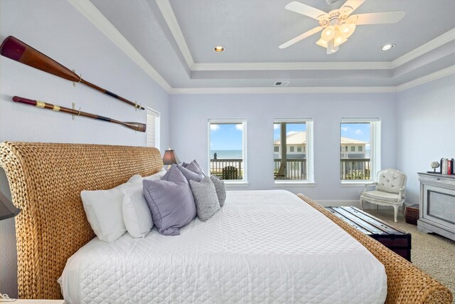 11622 Beachside, Galveston, TX 77554 - carpeted bedroom with a raised ceiling, a ceiling fan, crown molding, and recessed lighting