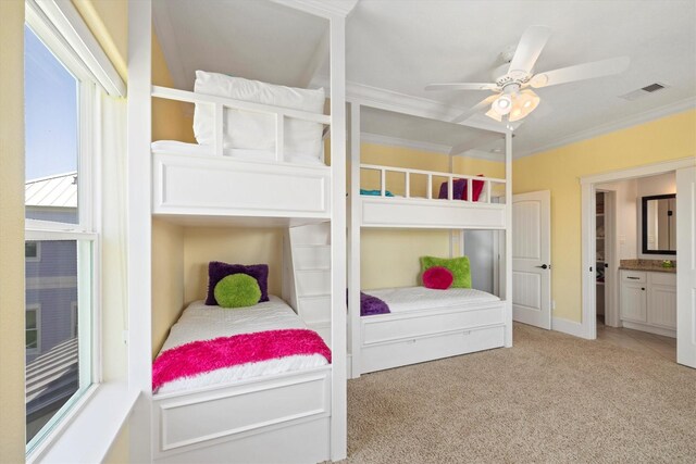 11622 Beachside, Galveston, TX 77554 - bedroom featuring ornamental molding, light carpet, ensuite bathroom, and ceiling fan