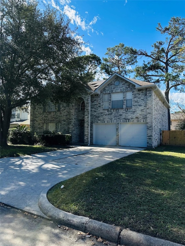 view of front of home featuring a front yard, fence, driveway, stone siding, and roof mounted solar panels