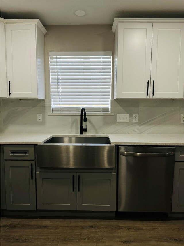 kitchen featuring sink, white cabinets, tasteful backsplash, and dishwasher