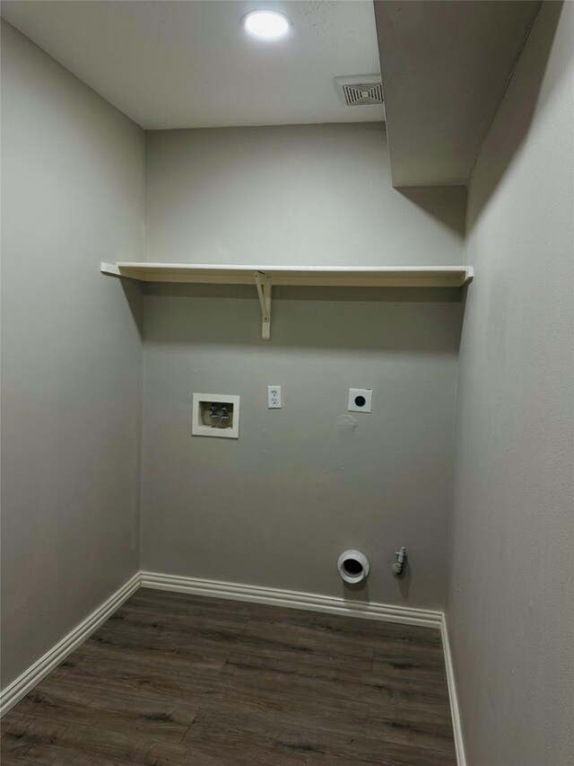 laundry area with hookup for a washing machine, electric dryer hookup, hookup for a gas dryer, and dark wood-type flooring