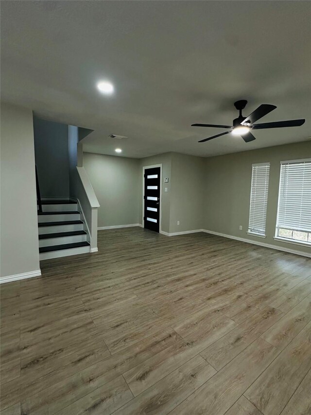 interior space with ceiling fan and light wood-type flooring