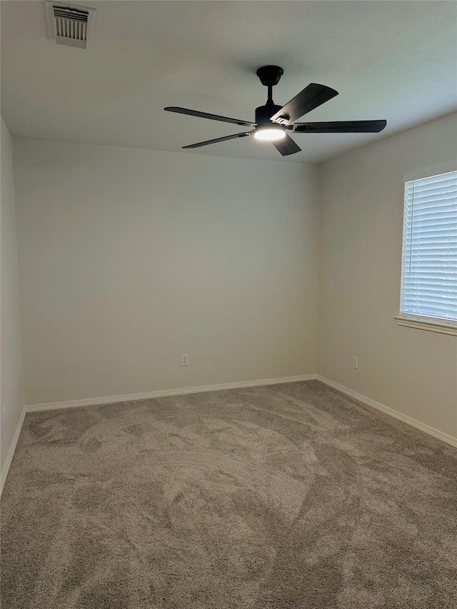 unfurnished room featuring carpet flooring and ceiling fan